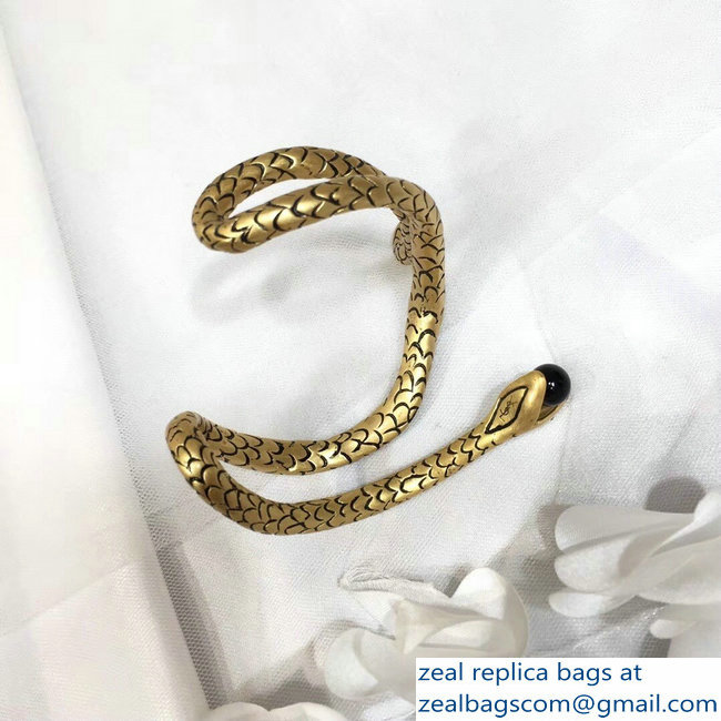 Saint Laurent Snake Bracelet In Gold Metal With A Black Glass Bead - Click Image to Close