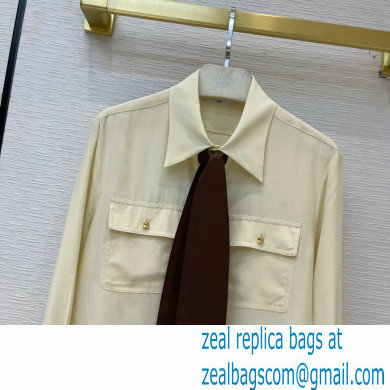 celine off white silk shirt with black tie 2021