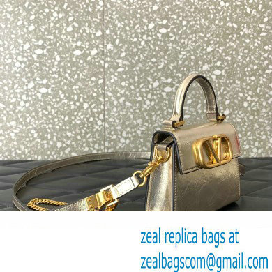 Valentino VSLING micro handbag in Calfskin Metallic Gold 2023