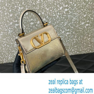 Valentino VSLING micro handbag in Calfskin Metallic Gold 2023 - Click Image to Close