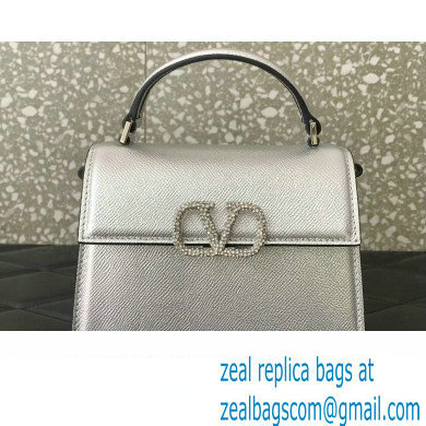 Valentino Mini VSLING Handbag in metallic Silver grainy calfskin with VLogo Signature crystals 2024