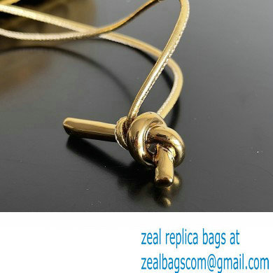 Bottega Veneta Long Clutch Andiamo With Handle Intrecciato leather bag Gold with metallic knot closure 2024