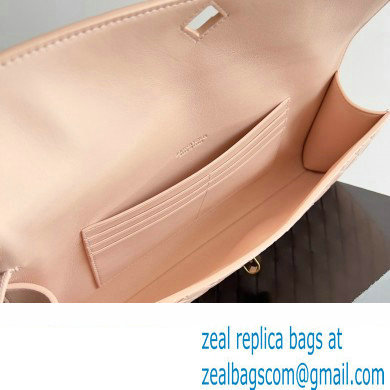 Bottega Veneta Long Clutch Andiamo With Handle Intrecciato leather bag Nude Pink with metallic knot closure 2024